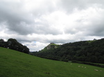 SX16159 Carreg Cennen Castle on top of distant cliffs.jpg